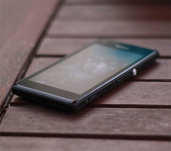 An outdated mobile phone on a wooden table